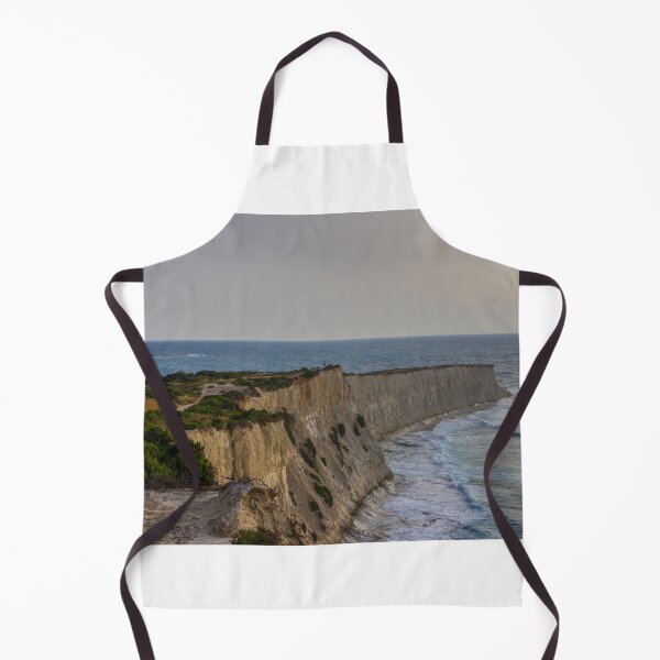 Item preview, Dramatic Coastal Cliffs Overlooking Rolling Sea Waves at Sunset With Rugged Vegetation and Path designed and sold by Nmallia.