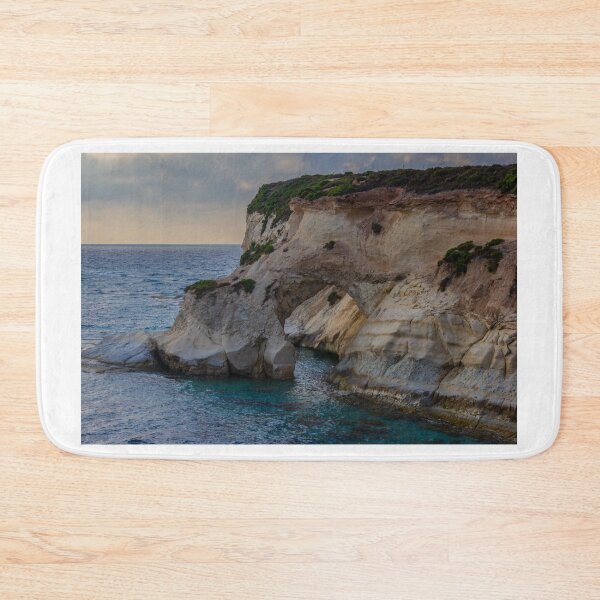 Item preview, Dramatic Coastal Sea Arch and White Limestone Cliffs Over Turquoise Waters at Sunset designed and sold by Nmallia.