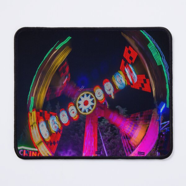 Item preview, Spinning Carnival Ride At Night With Colorful Lights And Motion Blur At An Amusement Park Fair designed and sold by Nmallia.