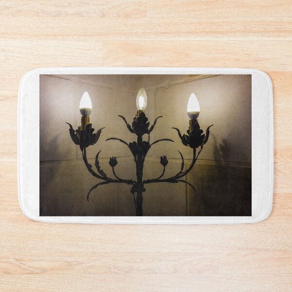 Item preview, Vintage Wrought Iron Wall Candelabra With Three Candle-Style Light Bulbs Against Stone designed and sold by Nmallia.