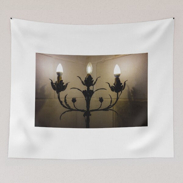 Item preview, Vintage Wrought Iron Wall Candelabra With Three Candle-Style Light Bulbs Against Stone designed and sold by Nmallia.