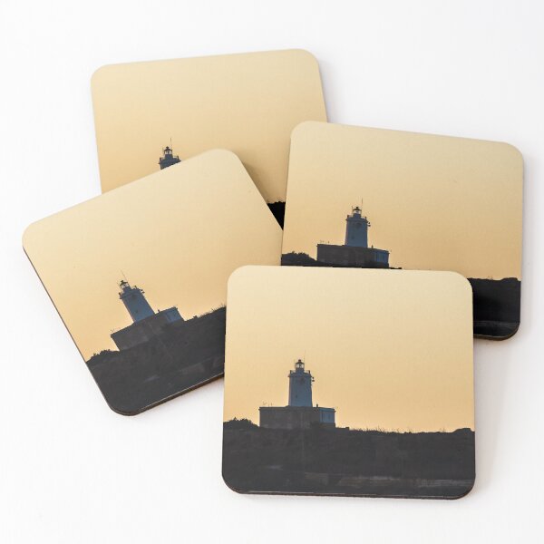 Item preview, Lighthouse Silhouette on Coastal Cliff at Golden Sunset Over Calm Sea Horizon designed and sold by Nmallia.