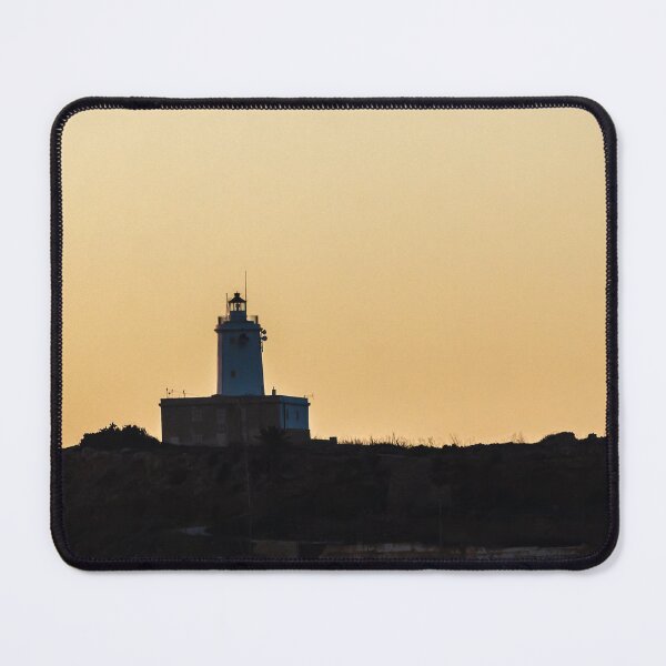 Item preview, Lighthouse Silhouette on Coastal Cliff at Golden Sunset Over Calm Sea Horizon designed and sold by Nmallia.