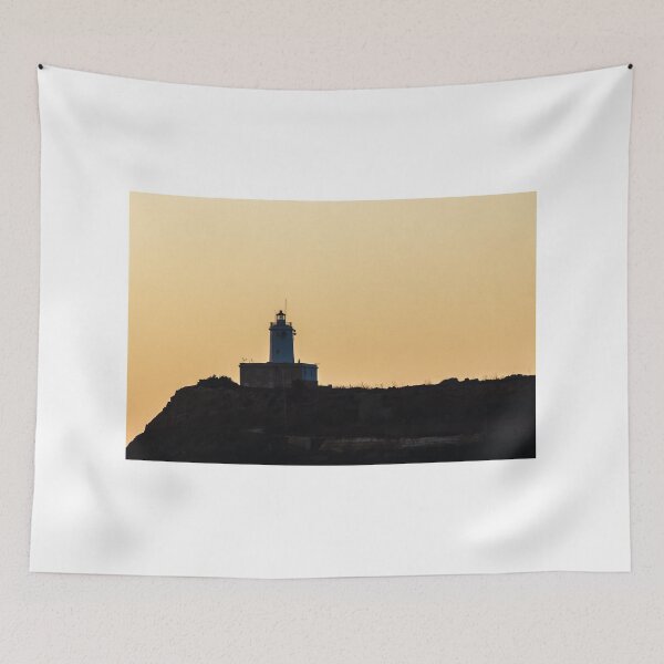 Item preview, Lighthouse Silhouette on Coastal Cliff at Golden Sunset Over Calm Sea Horizon designed and sold by Nmallia.
