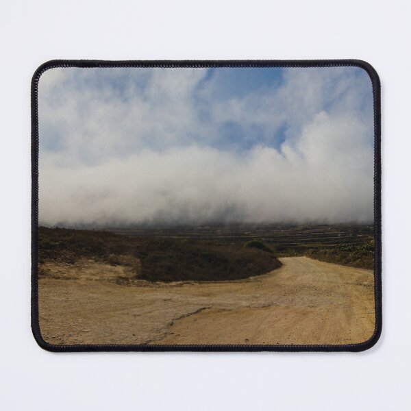 Item preview, Dirt Road Leading Through Foggy Countryside Landscape Under Dramatic Cloudy Sky designed and sold by Nmallia.