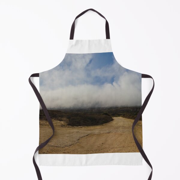Item preview, Dirt Road Leading Through Foggy Countryside Landscape Under Dramatic Cloudy Sky designed and sold by Nmallia.