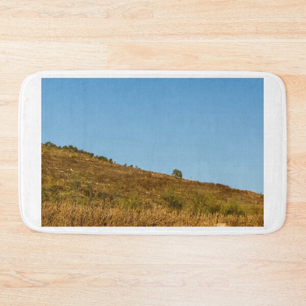 Item preview, Rural Landscape With Stone Walls and Rolling Hill Under Morning Fog and Blue Sky designed and sold by Nmallia.