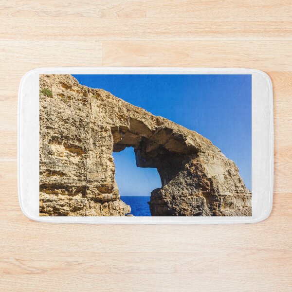 Item preview, Natural Sea Arch Framed By Rugged Limestone Cliffs Over Deep Blue Ocean designed and sold by Nmallia.