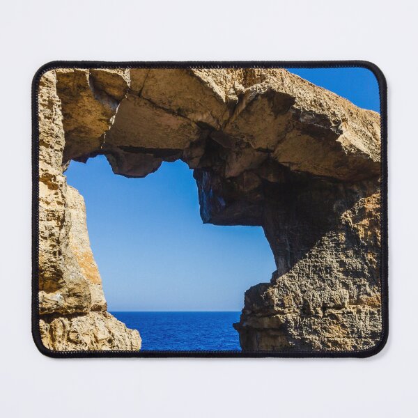 Item preview, Natural Sea Arch Framed By Rugged Limestone Cliffs Over Deep Blue Ocean designed and sold by Nmallia.