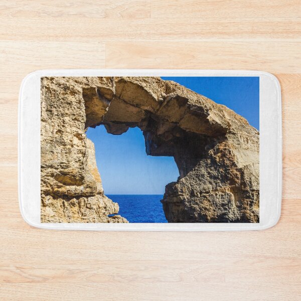 Item preview, Natural Sea Arch Framed By Rugged Limestone Cliffs Over Deep Blue Ocean designed and sold by Nmallia.