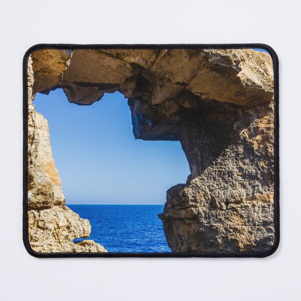 Item preview,  Natural Sea Arch Framed By Rugged Limestone Cliffs Over Deep Blue Ocean designed and sold by Nmallia.