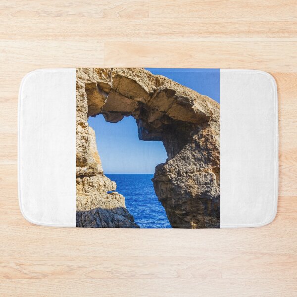 Item preview,  Natural Sea Arch Framed By Rugged Limestone Cliffs Over Deep Blue Ocean designed and sold by Nmallia.