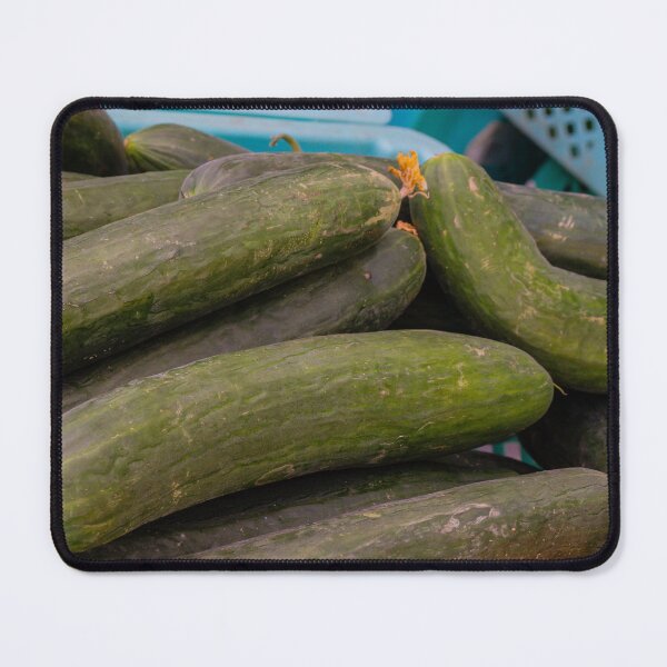 Item preview, Fresh Green Cucumbers Piled at Market Crates Fresh Produce Vegetables for Salads and Cooking designed and sold by Nmallia.