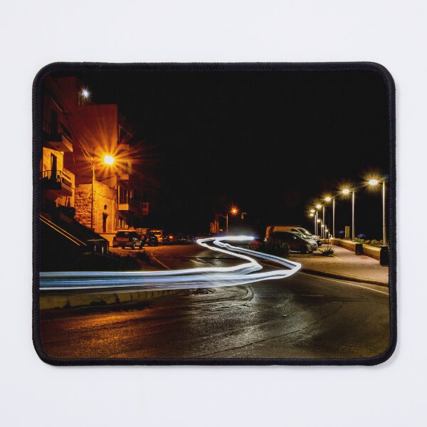 Item preview, Long Exposure Light Trails On Coastal Night Street With Lamp Posts And Parked Cars designed and sold by Nmallia.