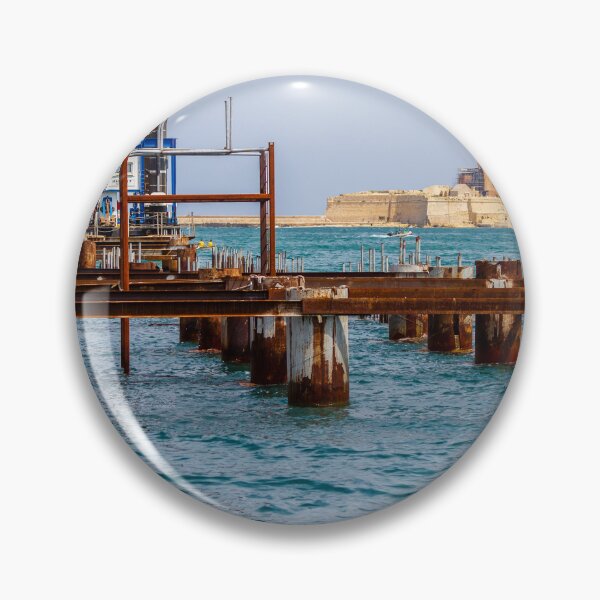 Item preview, Rusty Industrial Pier Construction And Harbour Works On Mediterranean Waterfront With Fort In Background designed and sold by Nmallia.