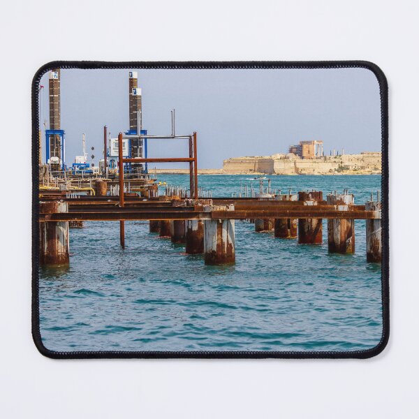 Item preview, Rusty Industrial Pier Construction And Harbour Works On Mediterranean Waterfront With Fort In Background designed and sold by Nmallia.