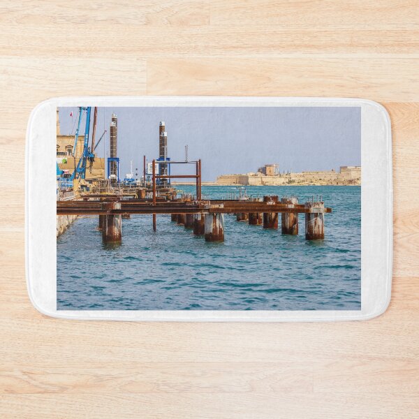 Item preview, Rusty Industrial Pier Construction And Harbour Works On Mediterranean Waterfront With Fort In Background designed and sold by Nmallia.