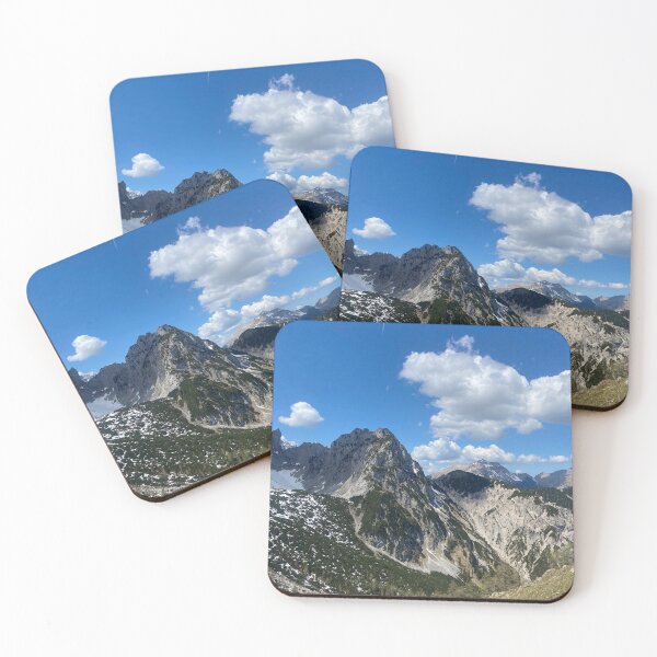 Item preview, Majestic mountain peaks with snow under a blue, cloudy sky designed and sold by Art of Momenz.