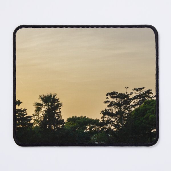 Item preview, Golden Sunset Silhouette of Trees and Palms Against a Calm Evening Sky Over Horizon designed and sold by Nmallia.