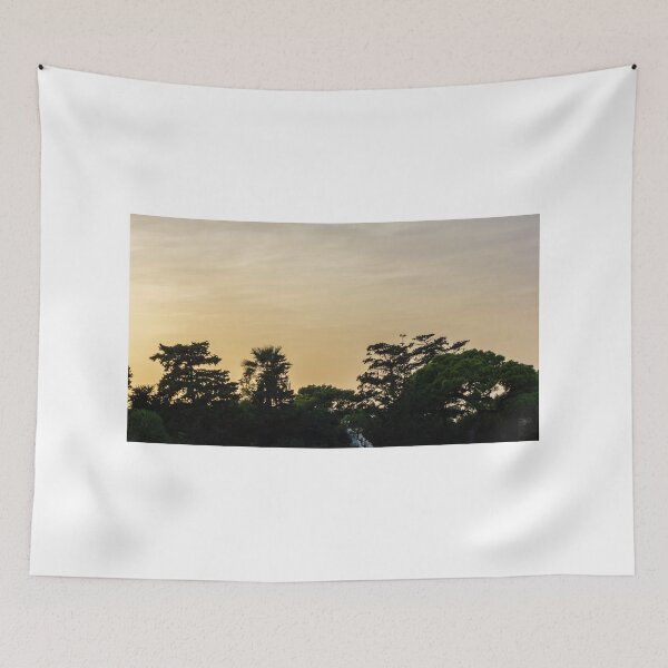 Item preview, Golden Sunset Silhouette of Trees and Palms Against a Calm Evening Sky Over Horizon designed and sold by Nmallia.