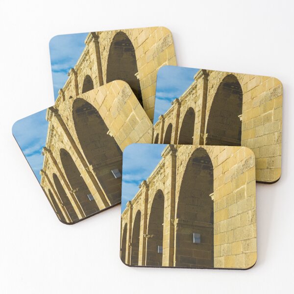 Item preview, Sunlit Stone Arched Colonnade Along Historic Building Facade Under Blue Sky designed and sold by Nmallia.