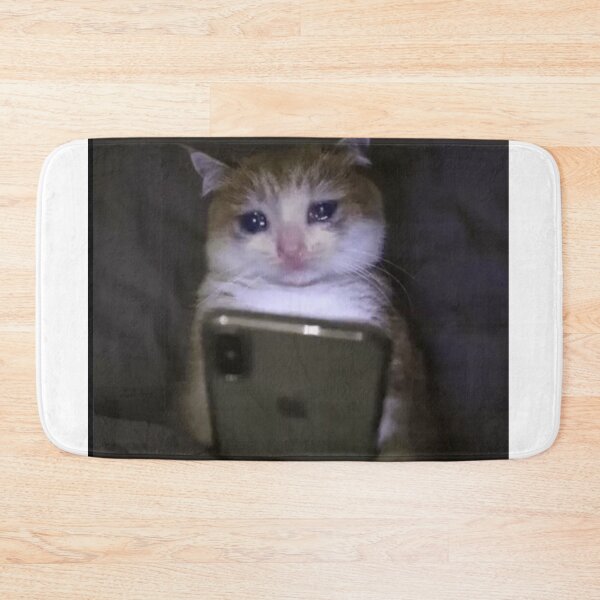 Item preview, sad cat holding phone meme designed and sold by cloudzer0000.