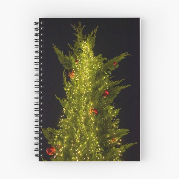 Item preview, Festive Christmas Tree Covered In Warm String Lights And Red Ornaments Against Night Sky designed and sold by Nmallia.