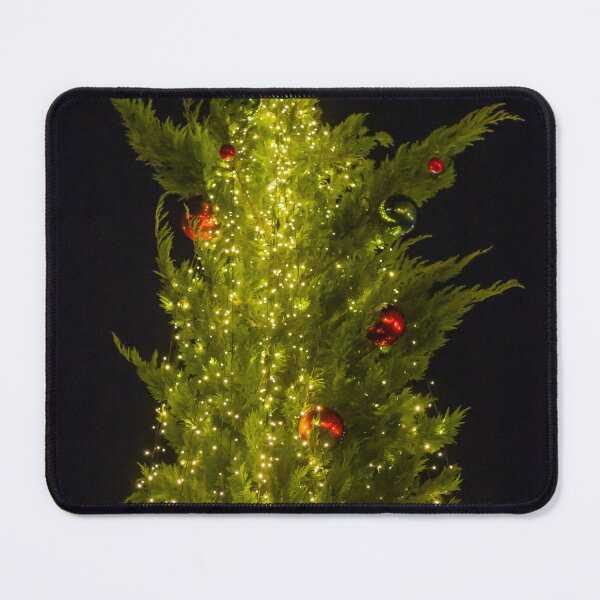 Item preview, Festive Christmas Tree Covered In Warm String Lights And Red Ornaments Against Night Sky designed and sold by Nmallia.