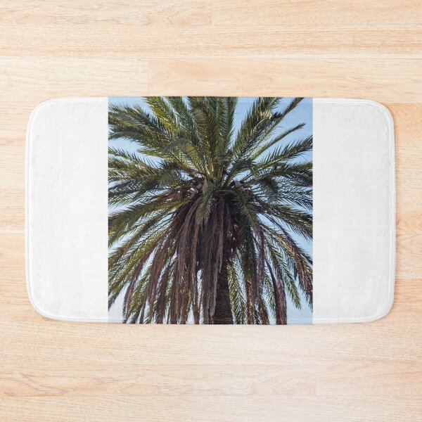 Item preview, Tall Palm Tree Against Clear Blue Sky With Lush Fronds and Tropical Vibe designed and sold by Nmallia.