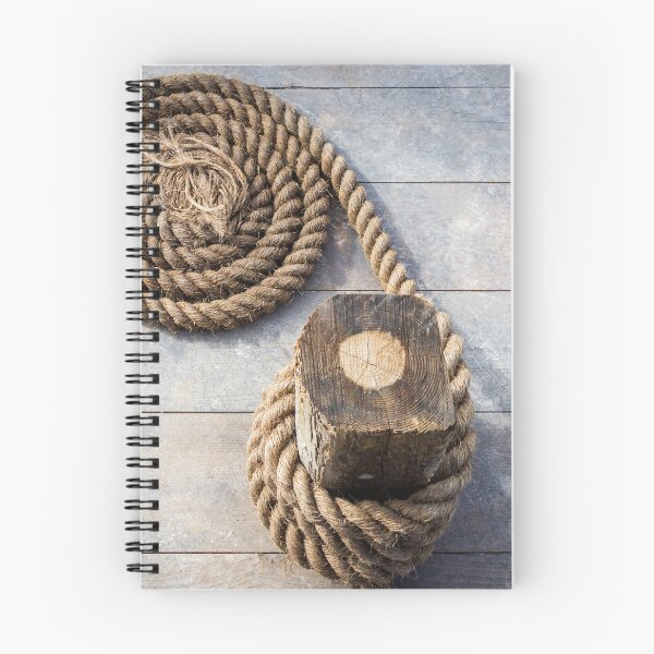 Item preview, Coiled Hemp Rope On Weathered Wooden Deck Nautical Marine Dock Line Close-Up designed and sold by Nmallia.