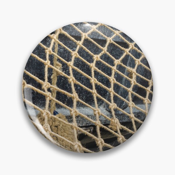 Item preview, Close-Up Of Rope Fishing Net Draped Over Weathered Wooden Boat Deck With Nautical Texture designed and sold by Nmallia.