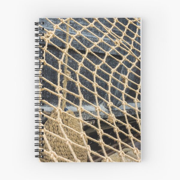 Item preview, Close-Up Of Rope Fishing Net Draped Over Weathered Wooden Boat Deck With Nautical Texture designed and sold by Nmallia.