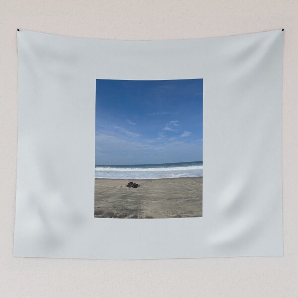 Item preview, Lonely driftwood on the wide ocean beach designed and sold by Art of Momenz.