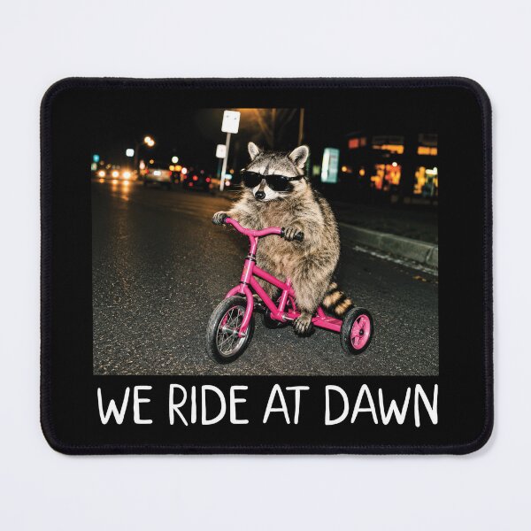 Item preview, Funny Raccoon Meme, We Ride at Dawn, Riding Tricycle Chaotic 2 designed and sold by OndaLifeCo.