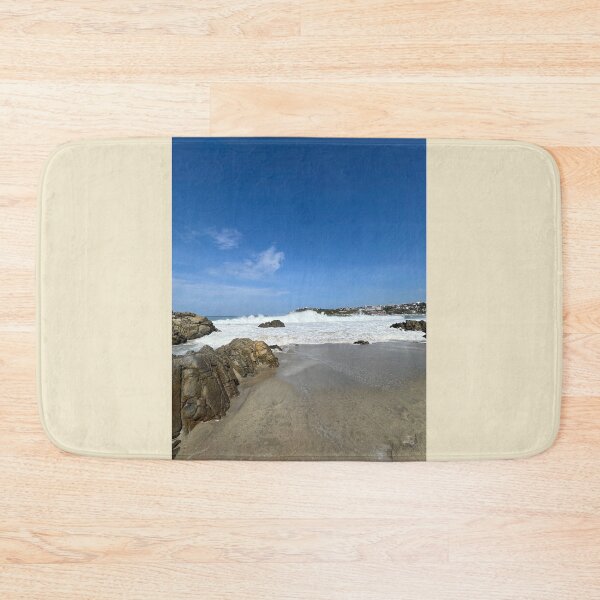 Item preview, Wild ocean surf at a rocky bay off a coastal town designed and sold by Art of Momenz.
