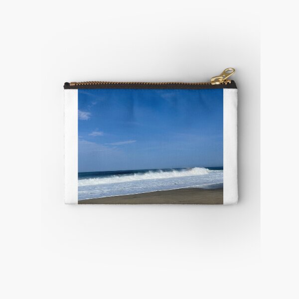 Item preview, Powerful white ocean spray on the wide sandy beach designed and sold by Art of Momenz.