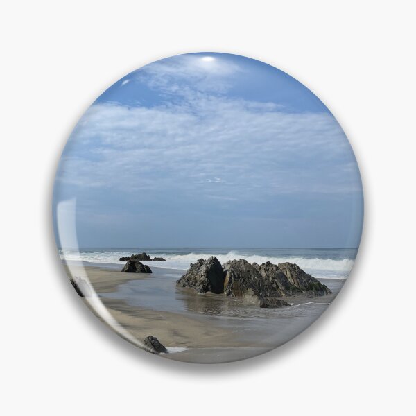Item preview, Striking rock formations on the wide sandy beach of the ocean designed and sold by Art of Momenz.