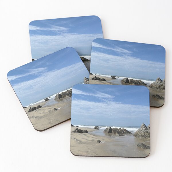 Item preview, Striking rock formations on the wide sandy beach of the ocean designed and sold by Art of Momenz.