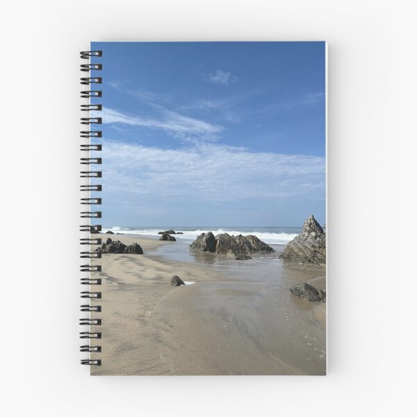 Item preview, Striking rock formations on the wide sandy beach of the ocean designed and sold by Art of Momenz.