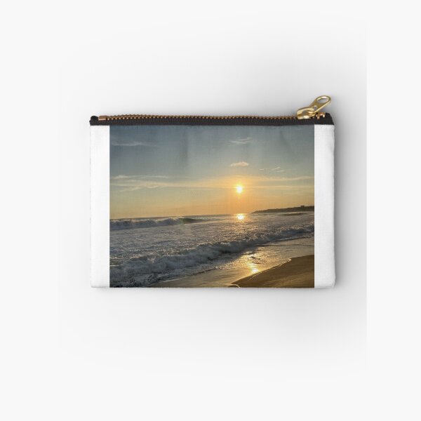Item preview, Warm evening sun over rolling ocean waves on the sandy beach designed and sold by Art of Momenz.