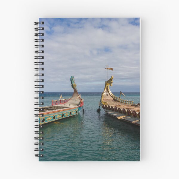 Item preview, Colorful Viking Boats Docked on Calm Sea Near Shore Under Cloudy Sky designed and sold by Nmallia.