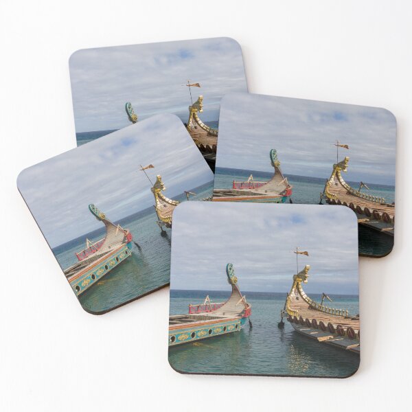 Item preview, Colorful Viking Boats Docked on Calm Sea Near Shore Under Cloudy Sky designed and sold by Nmallia.