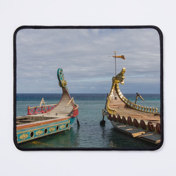Item preview, Colorful Viking Boats Docked on Calm Sea Near Shore Under Cloudy Sky designed and sold by Nmallia.
