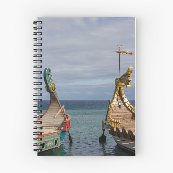 Item preview, Colorful Viking Boats Docked on Calm Sea Near Shore Under Cloudy Sky designed and sold by Nmallia.
