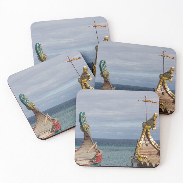 Item preview, Colorful Viking Boats Docked on Calm Sea Near Shore Under Cloudy Sky designed and sold by Nmallia.