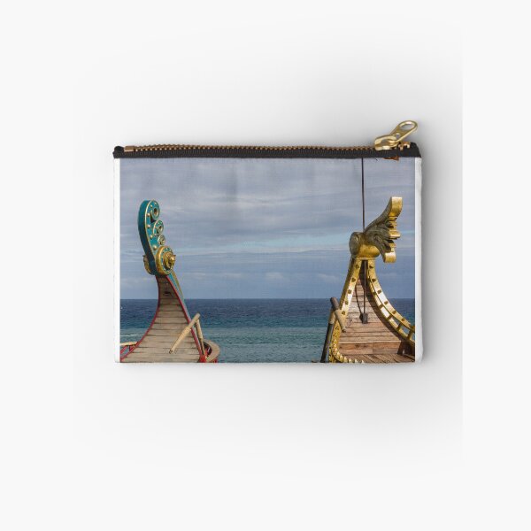 Item preview, Colorful Viking Boats Docked on Calm Sea Near Shore Under Cloudy Sky designed and sold by Nmallia.