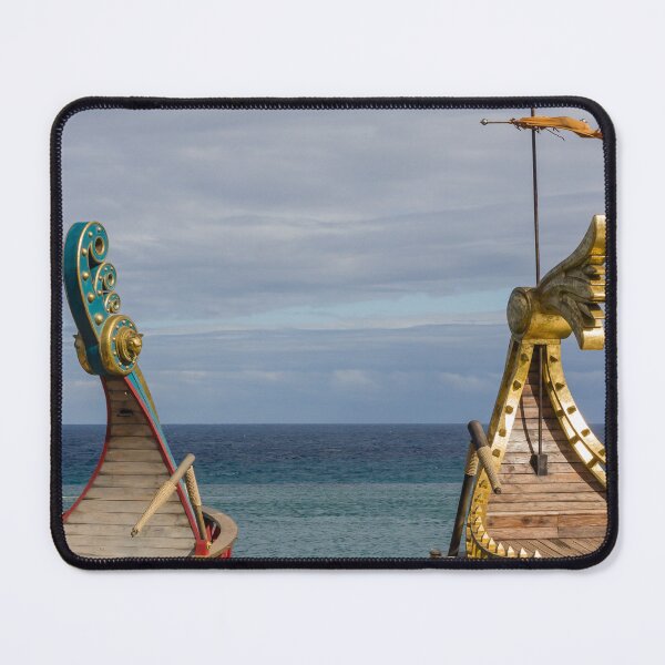 Item preview, Colorful Viking Boats Docked on Calm Sea Near Shore Under Cloudy Sky designed and sold by Nmallia.
