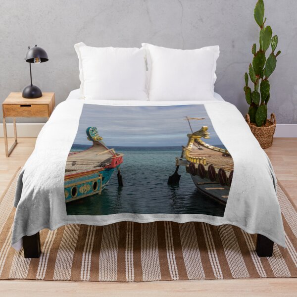 Item preview, Colorful Viking Boats Docked on Calm Sea Near Shore Under Cloudy Sky designed and sold by Nmallia.