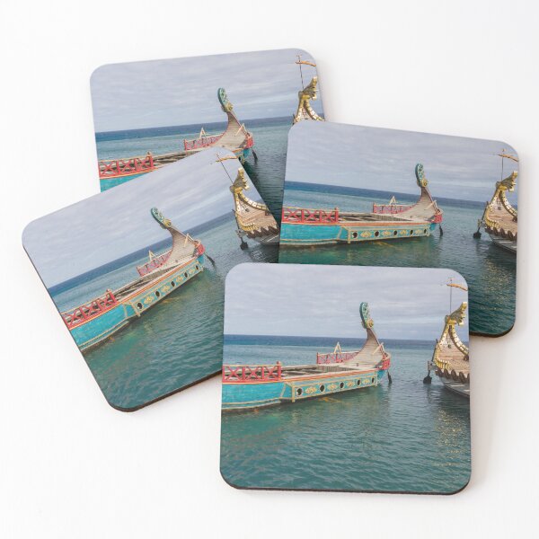 Item preview, Colorful Viking Boats Docked on Calm Sea Near Shore Under Cloudy Sky designed and sold by Nmallia.