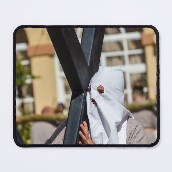 Item preview, Hooded Penitent Carrying Large Cross During Holy Week Religious Procession in Town Square designed and sold by Nmallia.